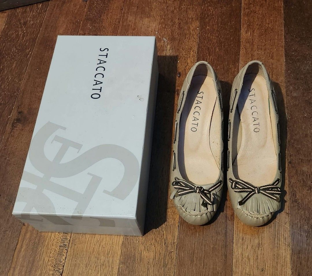 Vintage Staccato Wedge Shoes (Category: Wedges) located in Cebu City. Submitted by vincelouie30387 (Listing ID 1469010983, Image 1). Description: - Brand: Staccato - Type: Vintage Slip-on moccasin wedges - Size: EU 38 - Color: Beige upper with colorful floral print heel - Material: Leather - Features: Fringe and bow detail on the toe, printed wedge heel - Pinterest vibes.