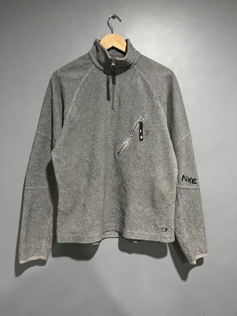 vintageNike Gray Fleece Quarter Zip Pullover (Category: Coats, Jackets and Outerwear) located in Maasin. Submitted by niconii090 (Listing ID 1468985954, Image 1). Description: - Brand: Nike - Style: Fleece pullover with quarter-zip collar - 📏 21 x 27.5 (inches) - Material: 100% polyester (Made in Indonesia) - Features: Embroidered Nike logo on left sleeve, small diagonal zippered chest pocket - Condition: Good overall, with a small stain just ab