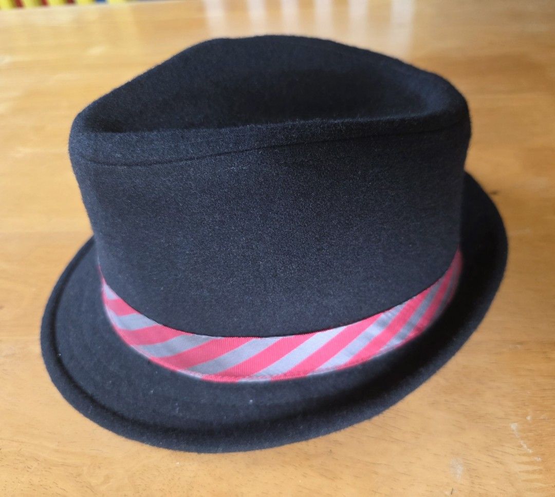 Volcom Black Fedora Hat With Red Stripe Ribbon (Category: Caps & Hats) located in Antipolo. Submitted by saslbs (Listing ID 1469014199, Image 2). Description: - Brand: Volcom - Style: Black wool blend fedora hat - Size: M/L - Details: Red and grey striped ribbon with a side bow and small metal logo tag - Condition: Clean interior sweatband Payment thru g-cash. Delivery thru Lbc or lalamove care of buyer. .