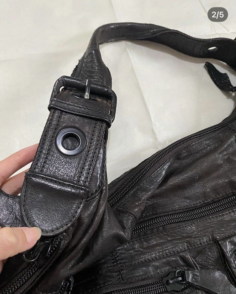 waltz leather bag (Category: Shoulder Bags) located in Minalabac. Submitted by binx.xoxo (Listing ID 1469092697, Image 2). Description: • length (body): 13.5 in • length (strap): 8 in •width: 18 in • base: 4.5 in • sturdy leather •7 compartments •damaged zipper inside •has minimal leather tear.