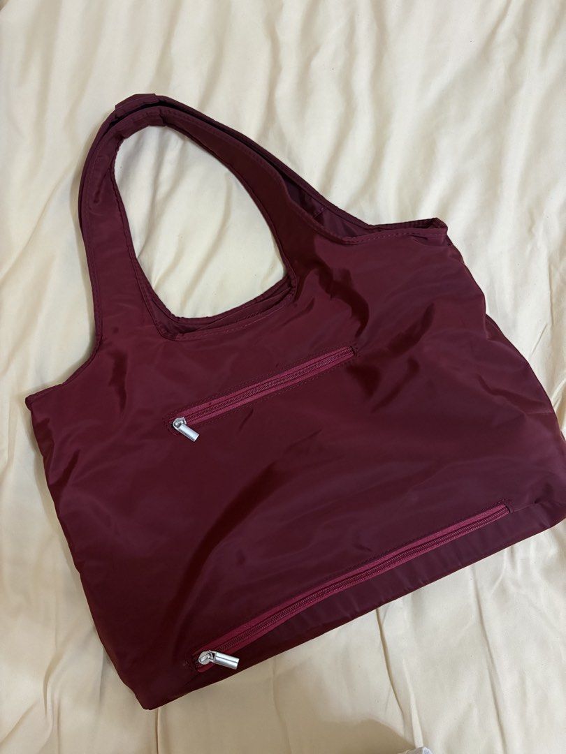 Wanderskye Everyday Tote Bag | Nylon Fabric | Waterproof | Maroon (Category: Tote Bags) located in Manila. Submitted by prelovedbymrsd (Listing ID 1469017175, Image 2). Description: Wanderskye Everyday Tote Bag | Maroon Selling my Wanderskye Everyday Tote in good-as-new condition! Original price: ₱1,709 Selling price: ₱800 only! Features: * Comfortable and portable * Waterproof nylon fabric * Front pocket + extra compartments * Hardware button cl
