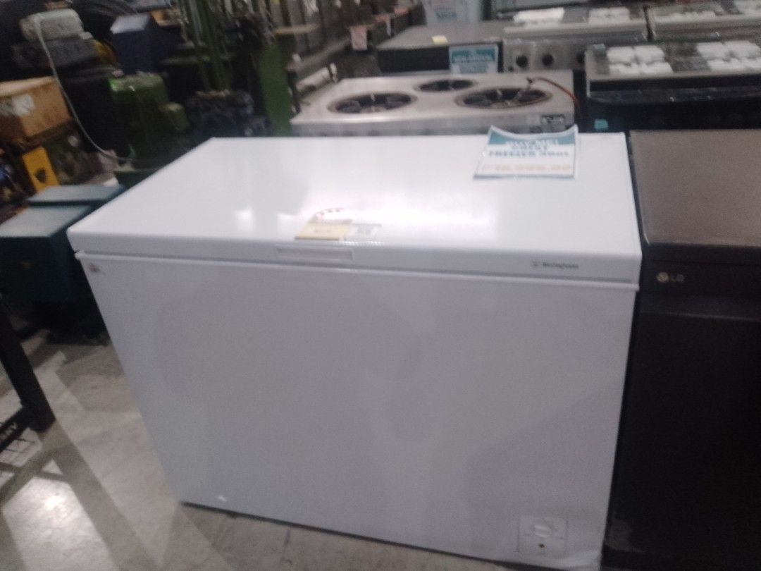 Westinghouse 300L Chest Freezer White (Category: Refrigerators and Freezers) located in Manila. Submitted by maryjane09. (Listing ID 1469037155, Image 2). Description: Westinghouse 300L chest freezer in white. Clean interior with a wire storage basket included inside. Energy rating label on top lid. Powers up via standard plug. External control knob at the front base. Solid build, plenty of freezing capacity for bulk groceries or meal prep..
