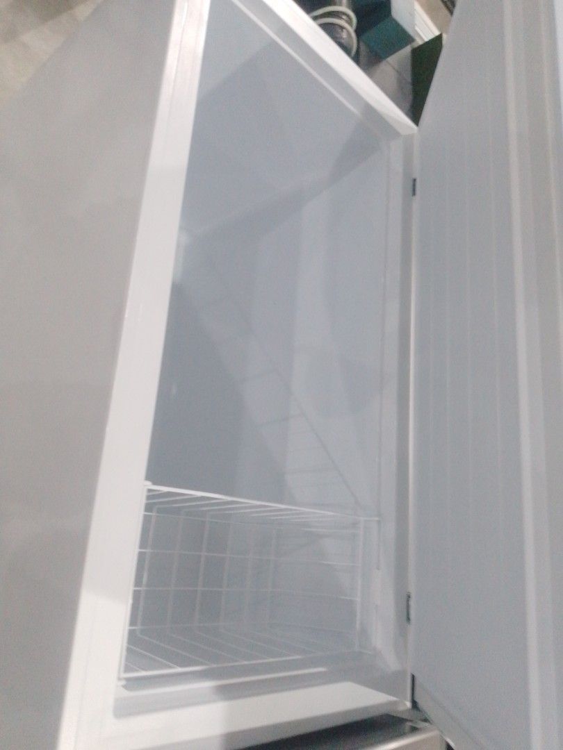 Westinghouse 300L Chest Freezer White (Category: Refrigerators and Freezers) located in Manila. Submitted by maryjane09. (Listing ID 1469037155, Image 3). Description: Westinghouse 300L chest freezer in white. Clean interior with a wire storage basket included inside. Energy rating label on top lid. Powers up via standard plug. External control knob at the front base. Solid build, plenty of freezing capacity for bulk groceries or meal prep..