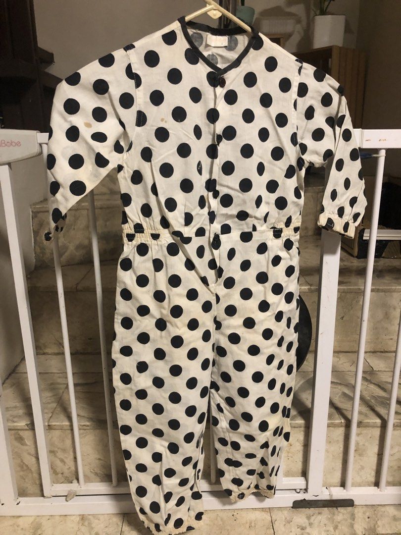 White and Black Polka Dot Jumpsuit (Category: Babies & Kids Fashion) located in Paranaque City. Submitted by adellistuff (Listing ID 1469029167, Image 2). Description: - Style: Cow costume with tail - Fit: Elastic waistline and elastic cuffs on long sleeves and legs - Closure: Convenient button-down front - Fabric: Lightweight and comfortable - Condition: Needs washing.