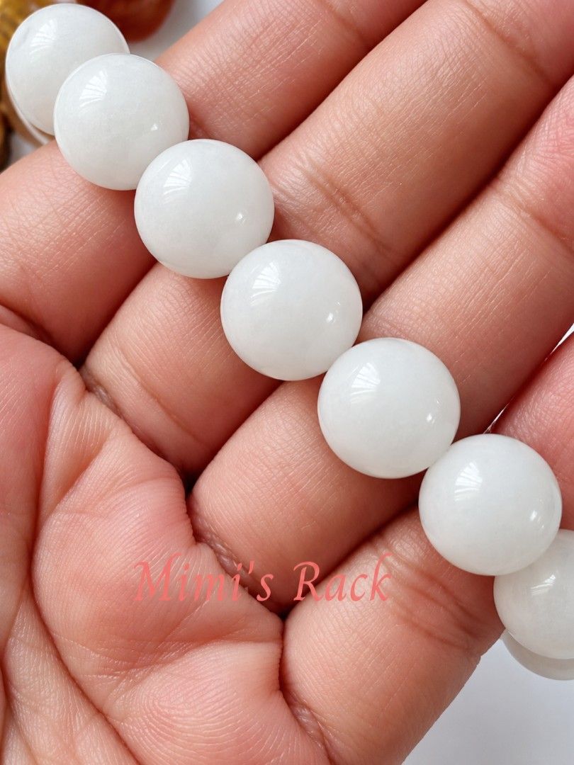 White Hetian Jade 12mm (Category: Bracelets) located in Taguig. Submitted by mimisrack (Listing ID 1469160548, Image 3). Description: 🤍🍀 Good Luck & Fortune — traditionally cherished as a symbol of blessings and favorable opportunities.💰 Wealth & Prosperity — associated with abundance, success, and financial well-being. 🧘 Peace & Serenity — symbolizes tranquility, patience, and inner harmony. 🛡️ Protection & Safety — traditionally worn as a 