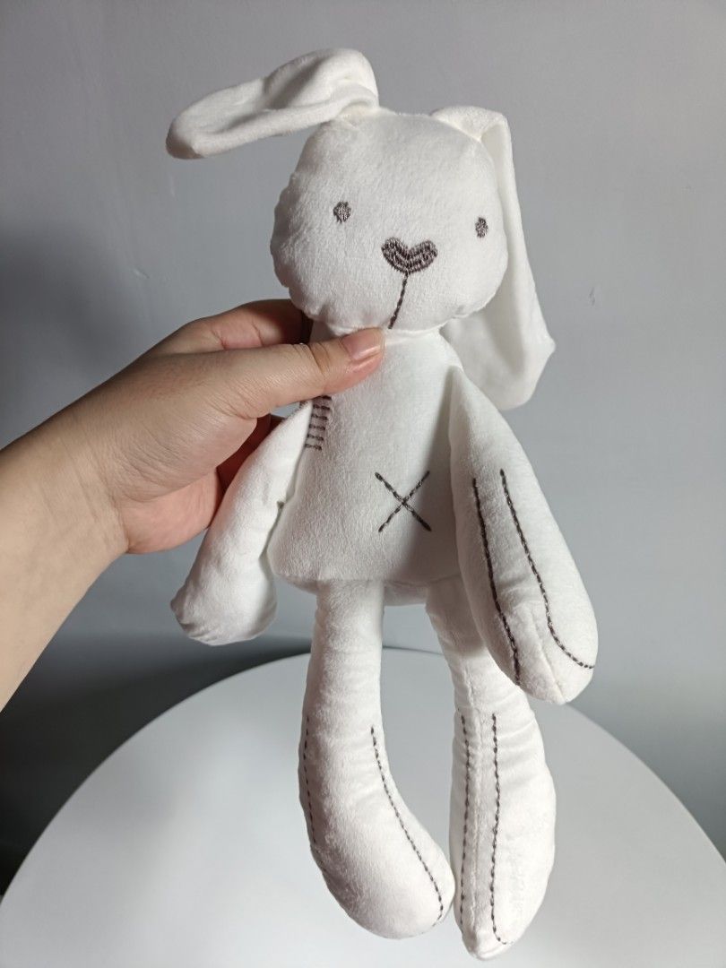 White plush bunny toy with stitched details (Category: Plushies & Soft Toys) located in Tanza. Submitted by misumei (Listing ID 1468987519, Image 2). Description: for 0-2yrs ** navideo lang, and naitago na sa loob ng storage organizer..