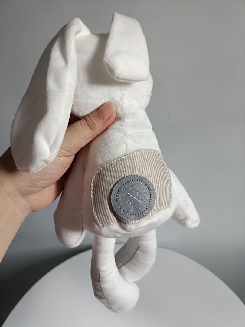 White plush bunny toy with stitched details (Category: Plushies & Soft Toys) located in Tanza. Submitted by misumei (Listing ID 1468987519, Image 3). Description: for 0-2yrs ** navideo lang, and naitago na sa loob ng storage organizer..