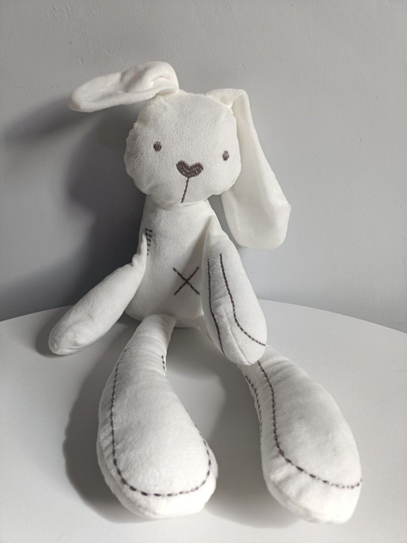 White plush bunny toy with stitched details (Category: Plushies & Soft Toys) located in Tanza. Submitted by misumei (Listing ID 1468987519, Image 1). Description: for 0-2yrs ** navideo lang, and naitago na sa loob ng storage organizer..