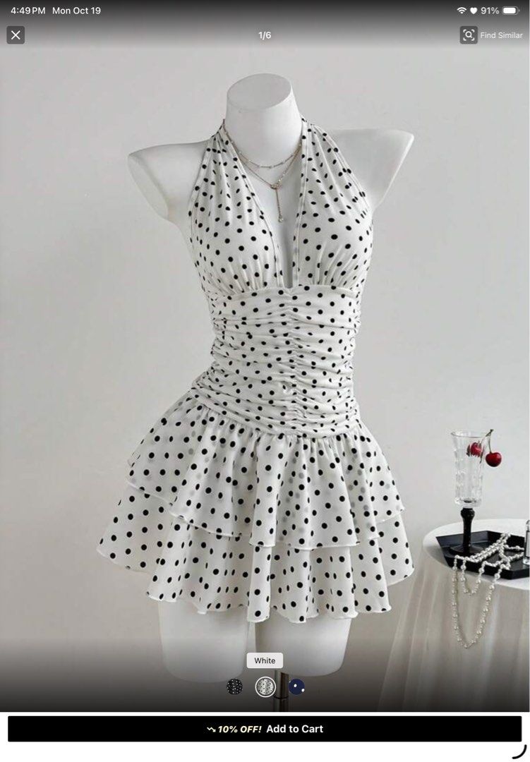 White Polka Dot Halter Dress (Category: Dresses) located in Santa Barbara. Submitted by user82739292 (Listing ID 1469014052, Image 2). Description: - Design: White mini dress with all-over black polka dots - Style: Halter neck with a sexy deep V-cut - Fit: Figure-hugging gathered ruched body - Bottom: Trendy layered ruffled skirt - Occasion: Ideal for dates, parties, or casual days out - Condition: Brand new / Excellent (Ready to ship!) - Mode of