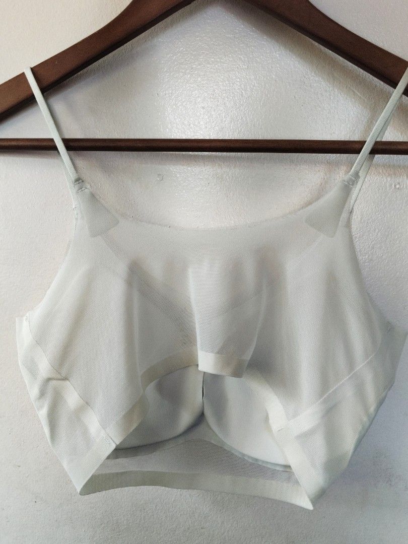 White seamless padded bralette with adjustable straps (Category: Undergarments & Loungewear) located in San Juan City. Submitted by rhennx (Listing ID 1469051886, Image 2). Description: - Color: Glacial Green - Material: Soft, stretchy mesh - Padded - Straps: Adjustable thin straps - Design: Double-layered with supportive underband - Condition: Clean, no stains or wear - Ideal for: Daily wear or lounging at home.