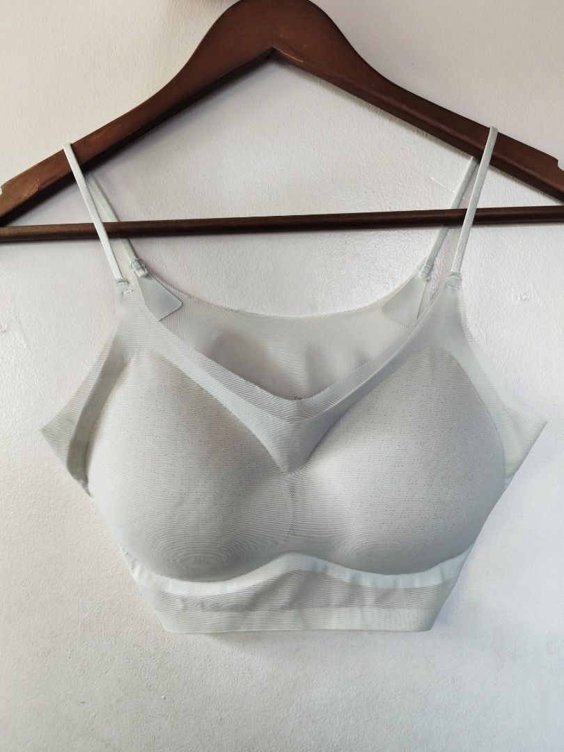 White seamless padded bralette with adjustable straps (Category: Undergarments & Loungewear) located in San Juan City. Submitted by rhennx (Listing ID 1469051886, Image 1). Description: - Color: Glacial Green - Material: Soft, stretchy mesh - Padded - Straps: Adjustable thin straps - Design: Double-layered with supportive underband - Condition: Clean, no stains or wear - Ideal for: Daily wear or lounging at home.