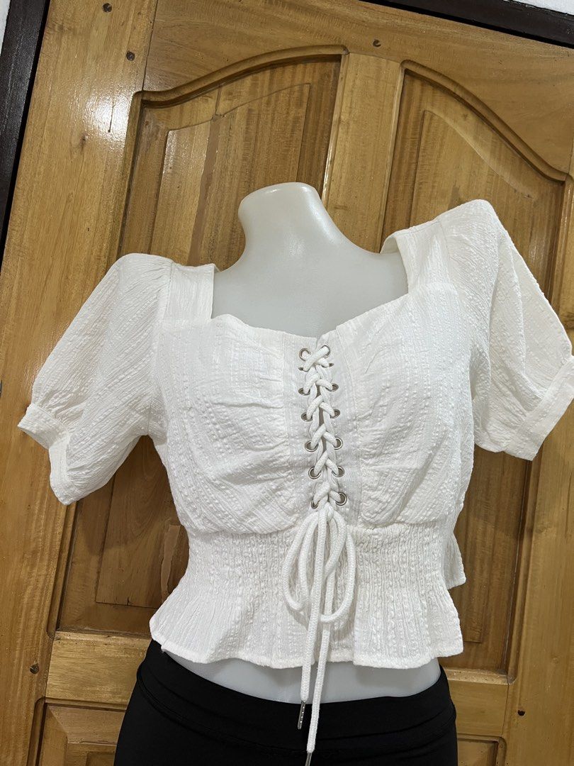 White Square Neck Blouse with Lace-Up Front (Category: Blouses) located in Manila. Submitted by princess.01.1 (Listing ID 1468964785, Image 1). Description: S-M size J&t only +55sf.