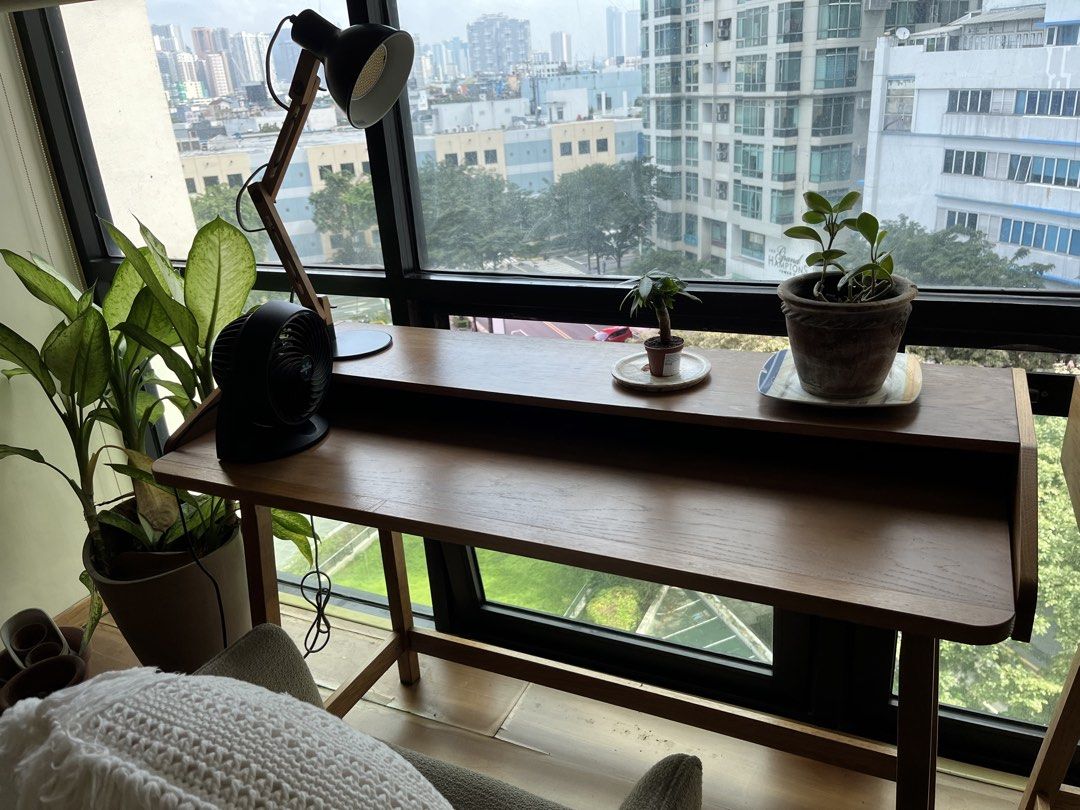 Wooden Writing Desk with Raised Shelf (Category: Tables & Sets) located in Taguig. Submitted by anina.anina (Listing ID 1469016982, Image 1). Description: Selling this stylish wooden desk bought from Habitat for 16k. It is sleek, easy on the eyes. Provides you a spacious workspace without making the room look cluttered. Great addition to a bedroom or a home office setup. Features: Upper shelf for monitors/lamps/plants and a spacious workspace for