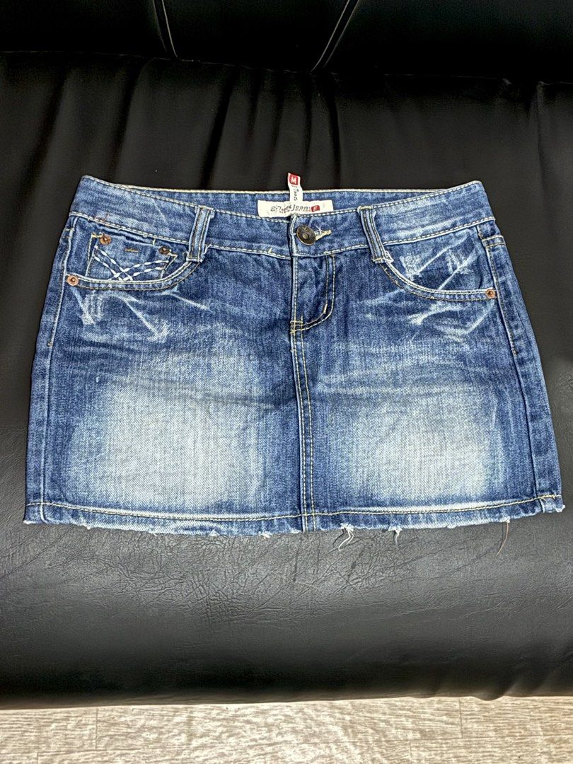 Wrangler Mini Skirt Blue Distressed Size M (Category: Skirts) located in Tanauan. Submitted by theitgirlsdibs4 (Listing ID 1469156643, Image 1). Description: - Brand: Wrangler - Size: Medium (tag attached) - Wash: Medium blue with cool Y2K distressed details and frayed hem - Style: Classic five-pocket design with contrast yellow stitching - Details: Branded metal hardware and signature back pocket patch - Condition: Brand new with tags, great for