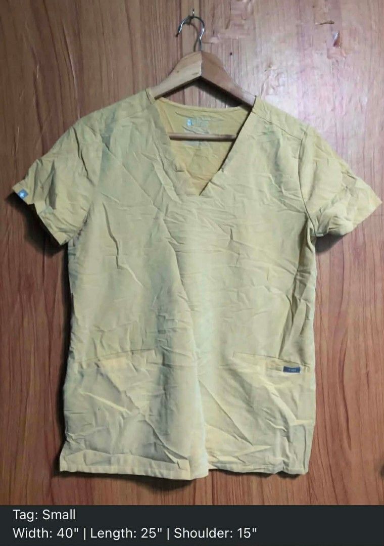 WW: Figs Limited Edition Light Gold Casma (Small on Tag) (Category: Others Tops) located in Baguio. Submitted by thanksgodforthedogs (Listing ID 1469090802, Image 2). Description: Limited Edition Light Gold Casma Manual Measurements (Medida) W:40" Shoulders Width: 15" L:25" Tag: Small 3 Pockets Nicer in Actual Yung Kulay Like New to Good as Last Price: P1,500 + SF.