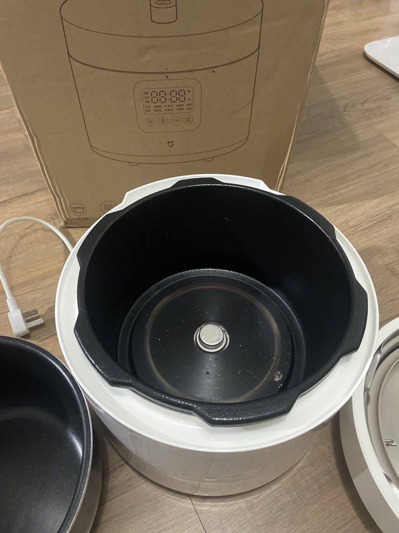 Xiaomi Smart Electric Pressure Cooker 5L (Category: Cookers) located in Makati City. Submitted by ngtoo (Listing ID 1469037797, Image 2). Description: - Brand: Xiaomi Smart Electric Pressure Cooker - Capacity: 5 Liters (Large and heavy-duty) - Inclusions: Main unit, lid, power cord, original box, AND two inner cooking pots - Condition: Clean inside and out, ready to use - Features: User-friendly front control panel, perfect for fast meals, rice, 