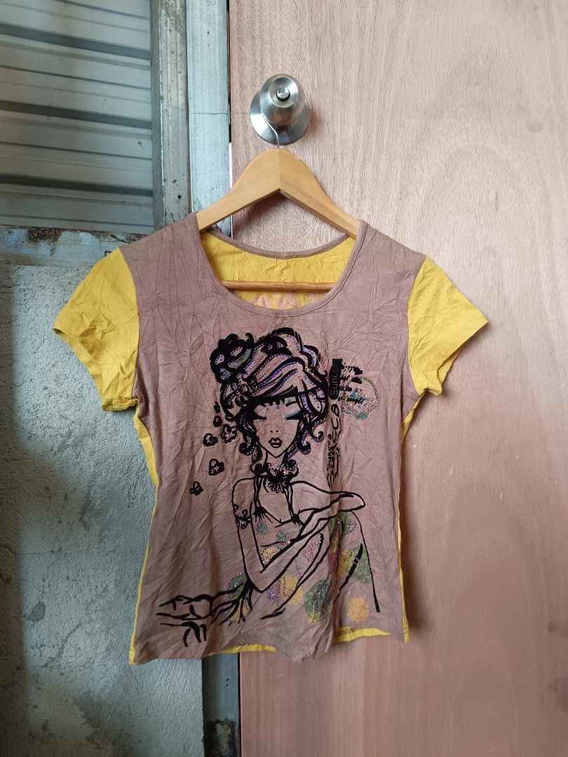 Y2k graphic top (Category: Shirts) located in Davao. Submitted by mln-boutique (Listing ID 1468969836, Image 1). Description: size - M good condition custo design.