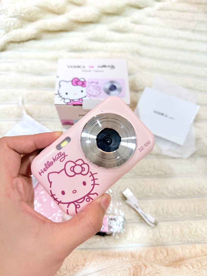 Yashica Hello Kitty DZ-100 Digital Camera (Category: Cameras) located in Naga. Submitted by clareee_ (Listing ID 1469048930, Image 3). Description: 🎀 FOR SALE: Yashica x Hello Kitty DZ-100 Digital Camera 💗📸 ♡ Pink Hello Kitty edition ♡ Bought in 2025 ♡ Used only once ♡ Good condition ♡ Complete with original box & accessories ♡ Includes 32GB SD card + connector Original price: ₱6,899 Selling price: ₱4,800 RFS: Decluttering DM if interested! 💌