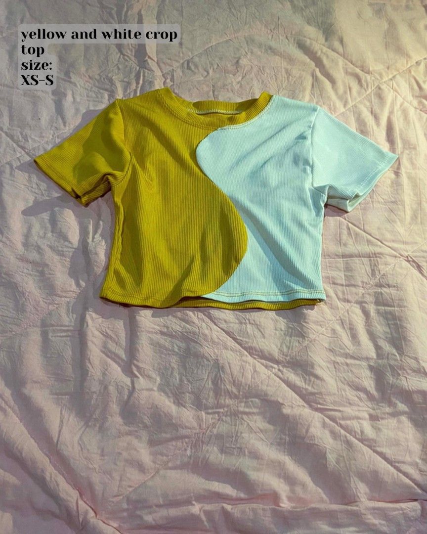 Yellow and white crop top (Category: Sleeveless) located in Santa Cruz. Submitted by gelpcz (Listing ID 1468947923, Image 1). Description: - Color: Yellow and white with a trendy wavy design - Material: Comfortable ribbed fabric - Fit: XS to S - Style: Short sleeves, crew neckline, crop top - Condition: Great for sunny casual days.
