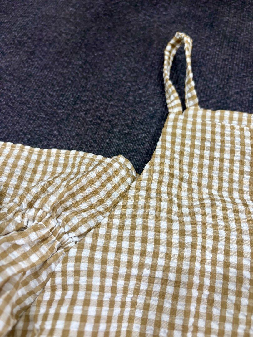 Yellow Cold Shoulder Blouse With Puff Sleeves (Category: Blouses) located in Quezon City. Submitted by fast.closetfinds (Listing ID 1469015843, Image 2). Description: - Design: Brown and white gingham pattern with a square neckline - Features: Cold-shoulder style with dramatic puff sleeves and ruffled cuffs - Fabric: Lightweight and textured for all-day comfort - Styling: Great casual piece for weekends, dates, or casual outings; looks amazing pa