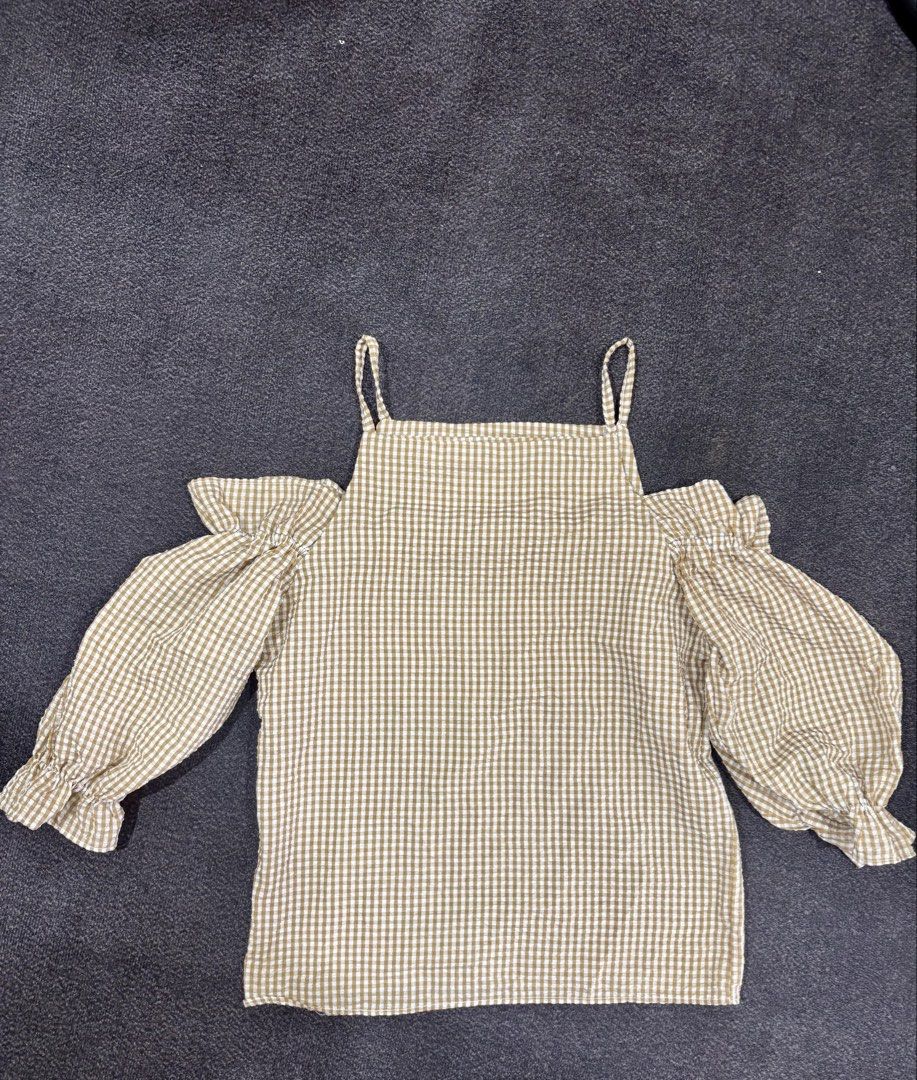 Yellow Cold Shoulder Blouse With Puff Sleeves (Category: Blouses) located in Quezon City. Submitted by fast.closetfinds (Listing ID 1469015843, Image 1). Description: - Design: Brown and white gingham pattern with a square neckline - Features: Cold-shoulder style with dramatic puff sleeves and ruffled cuffs - Fabric: Lightweight and textured for all-day comfort - Styling: Great casual piece for weekends, dates, or casual outings; looks amazing pa