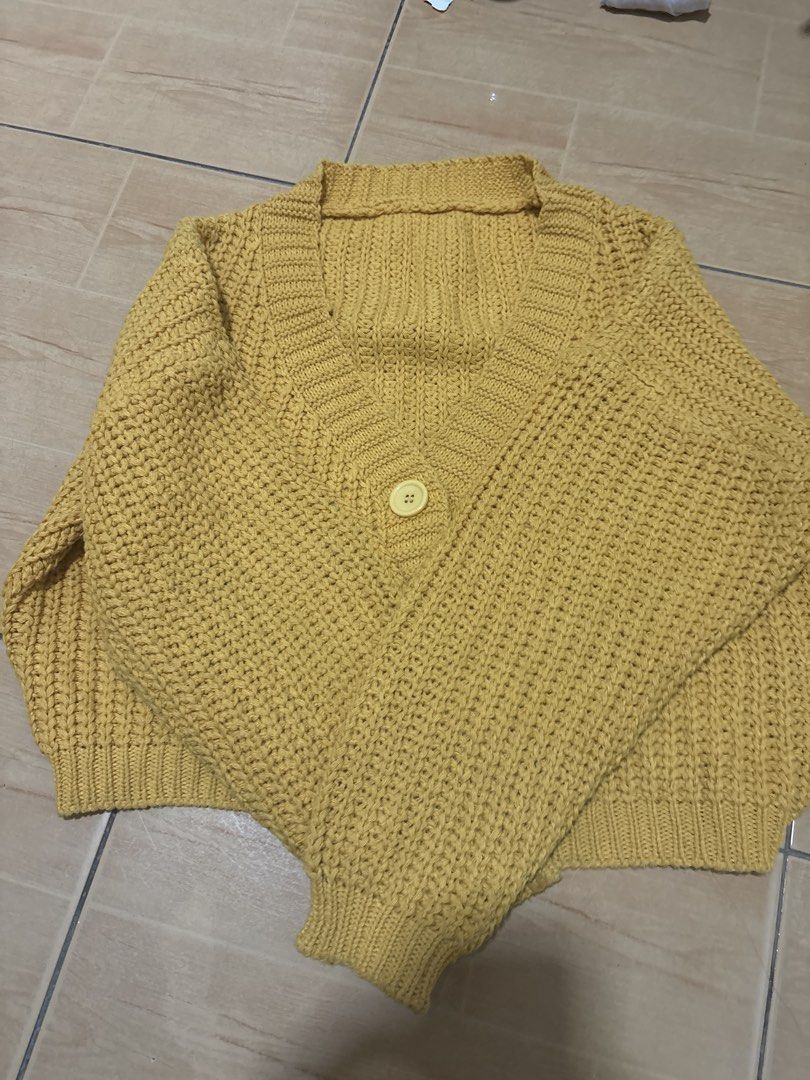 Yellow Knit Cropped Cardigan Sweater (Category: Coats, Jackets and Outerwear) located in Cabuyao City. Submitted by airpz (Listing ID 1469068402, Image 2). Description: - Color: Mustard yellow - Style: Cropped, heavy chunky knit - Features: V-neck with ribbed trim, long sleeves with ribbed cuffs and hem, single large front button - Condition/Vibe: Cozy, warm, and stylish for everyday wear.