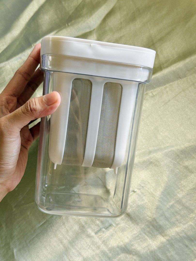 Yogurt Strainer (Category: Coffee Machines & Makers) located in Camalig. Submitted by patdeclutters (Listing ID 1468935055, Image 2). Description: Used for 3 times only, like new!!! 1300ml RFS: Prefer cheesecloth method - Clear plastic pitcher with built-in mesh filter basket - Secure white lid featuring a convenient twist-lock handle mechanism - Easy to take apart, wash, and clean after use.