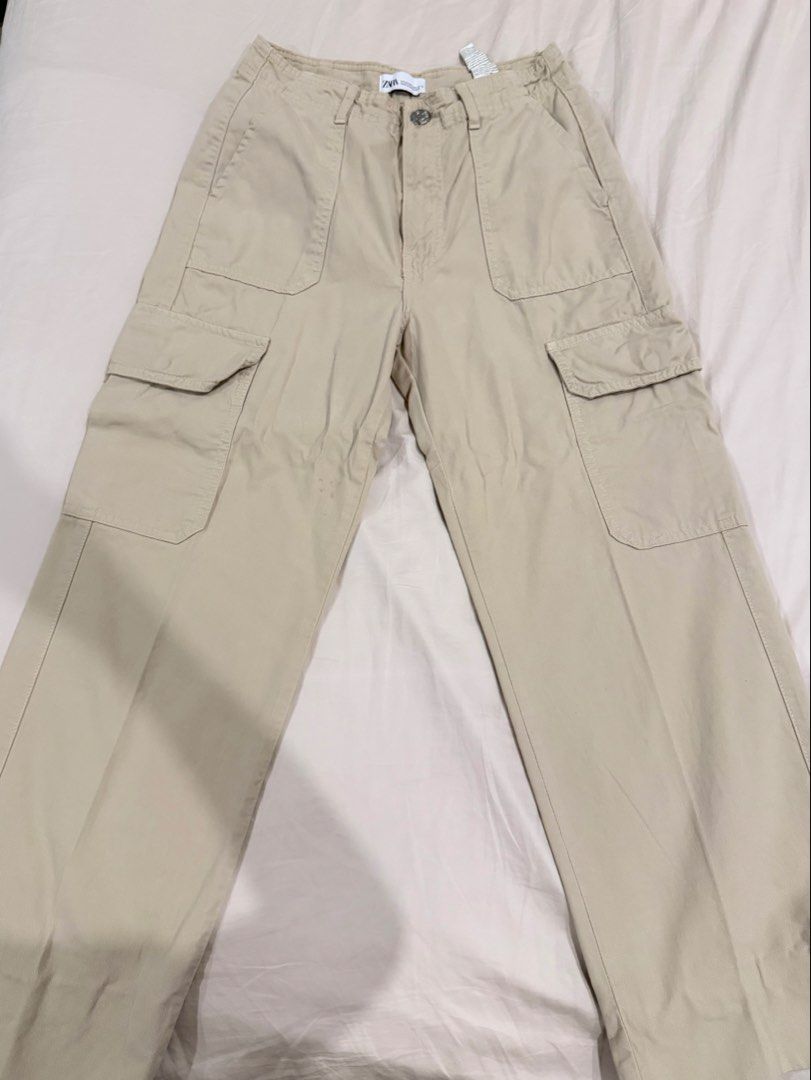 Zara beige cargo pants size EUR 34 (Category: Jeans) located in Manila. Submitted by pinkyclothes1267 (Listing ID 1469029327, Image 1). Description: - Brand: Zara - Style: Cargo pants with multiple front and back utility pockets - Color: Classic beige - Size: EUR 34 / USA 2 / MEX 24 - Material: 100% Cotton (Made in Bangladesh) - Closure: Button closure with zip fly and standard belt loops - Condition: Excellent, ready to wear.