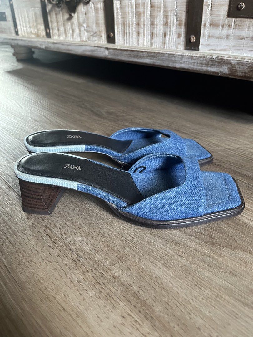 Zara Denim Sandals Size 37 (Category: Flats & Sandals) located in Antipolo. Submitted by rrraves (Listing ID 1468994868, Image 2). Description: - Brand: Zara - Style: Denim mules with square toes and chunky block heels - Size: EU 37 - Material: Blue denim fabric upper, dark insoles, and wooden-look heel - Origin: Made in Spain Hardly used. No issues. MOP: BPI or GCash only. Slightly negotiable. Buyer pays for shipping. Sale is final. .