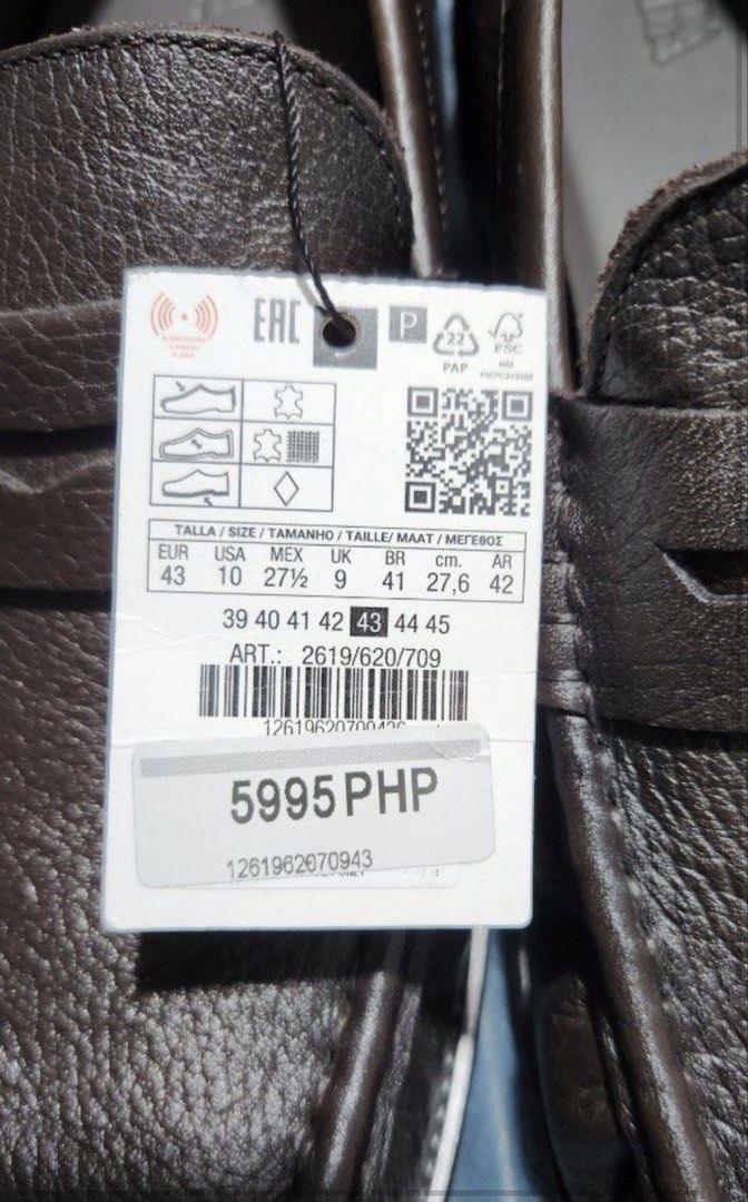 Zara Leather Loafers (Category: Casual Shoes) located in Makati City. Submitted by andoypakoykoy (Listing ID 1468973209, Image 2). Description: Dark brown leather penny loafers. Slip-on design with moc toe stitching and stacked heels. Genuine leather upper and lining. Brand new with original retail tag attached. Retail price 5995 PHP. Article number 2619/620/709. Size 43 EUR / 10 USA..