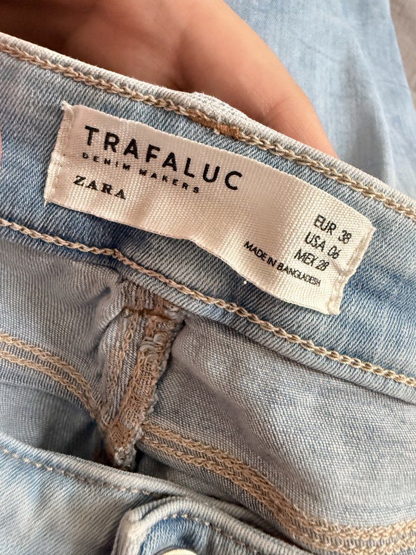Zara Light Wash Distressed Jeans (Category: Jeans) located in Paranaque City. Submitted by roanclauds (Listing ID 1468953689, Image 3). Description: - Brand: Zara Trafaluc (TRF Denim) - Color: Light blue wash with trendy distressed details on knees and upper front - Size: EUR 38 / USA 06 / MEX 28 - Style: Five-pocket styling with zip fly and button closure - Details: Embossed back leather patch - Condition: Great pre-loved condition, perfect for 
