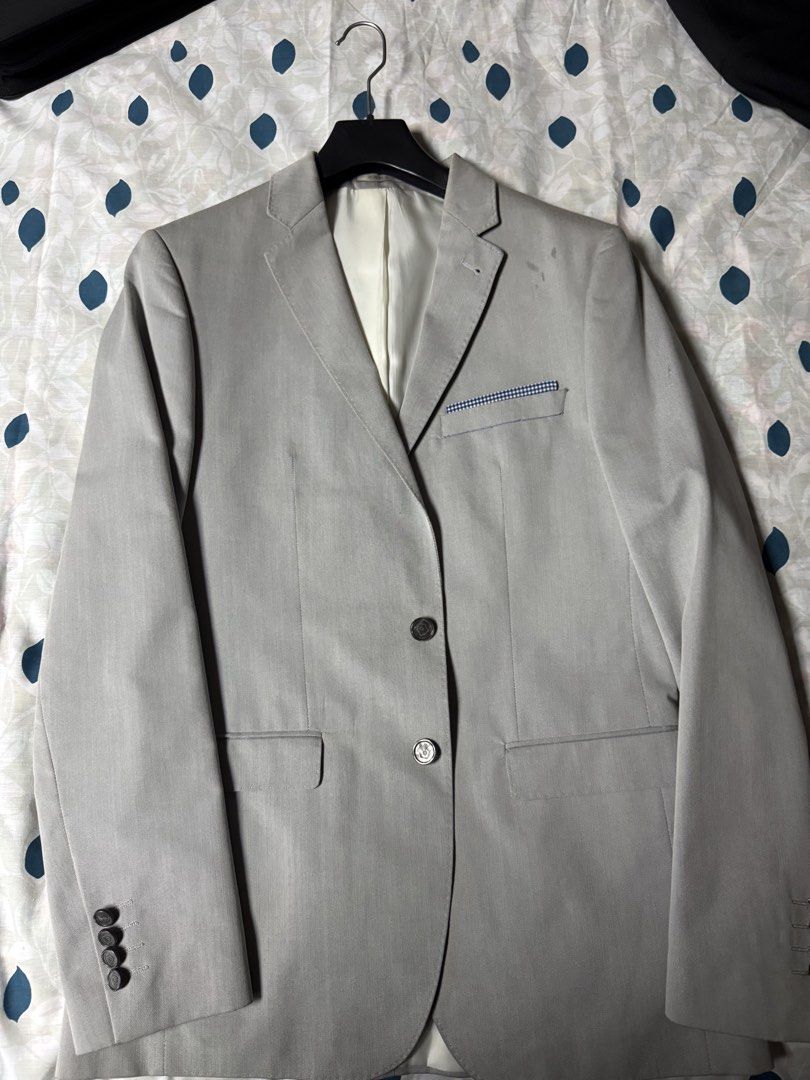 Zara Man Grey Suit Blazer Size 50 (Category: Coats, Jackets and Outerwear) located in Manila. Submitted by seangoart (Listing ID 1469036768, Image 1). Description: - Brand: Zara Man - Color: Grey - Size: 50 (US 40) - Fit: Structured - Details: Two-button front closure, decorative cuff buttons - Lining & Trim: Blue and white gingham interior lining and matching pocket square trim - Condition: Brand new with extra buttons attached on the tag.