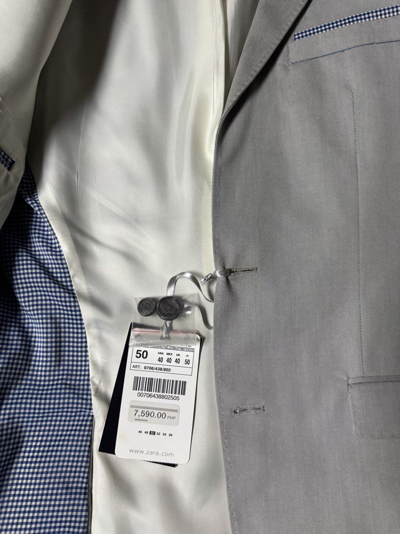 Zara Man Grey Suit Blazer Size 50 (Category: Coats, Jackets and Outerwear) located in Manila. Submitted by seangoart (Listing ID 1469036768, Image 3). Description: - Brand: Zara Man - Color: Grey - Size: 50 (US 40) - Fit: Structured - Details: Two-button front closure, decorative cuff buttons - Lining & Trim: Blue and white gingham interior lining and matching pocket square trim - Condition: Brand new with extra buttons attached on the tag.