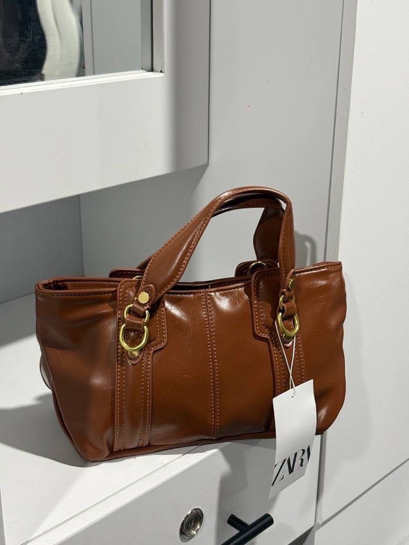 Zara Mini City Tote Bag (Category: Cross-body Bags) located in Caloocan City. Submitted by hamhazeyto17517 (Listing ID 1469057398, Image 2). Description: PRE ORDER Authentic & Original Brand Delivered within 4-5 days Colors: Black & Coffee Brown with long strap Loc: Bulacan & Tarlac.