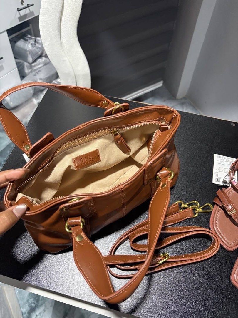 Zara Mini City Tote Bag (Category: Cross-body Bags) located in Caloocan City. Submitted by hamhazeyto17517 (Listing ID 1469057398, Image 3). Description: PRE ORDER Authentic & Original Brand Delivered within 4-5 days Colors: Black & Coffee Brown with long strap Loc: Bulacan & Tarlac.