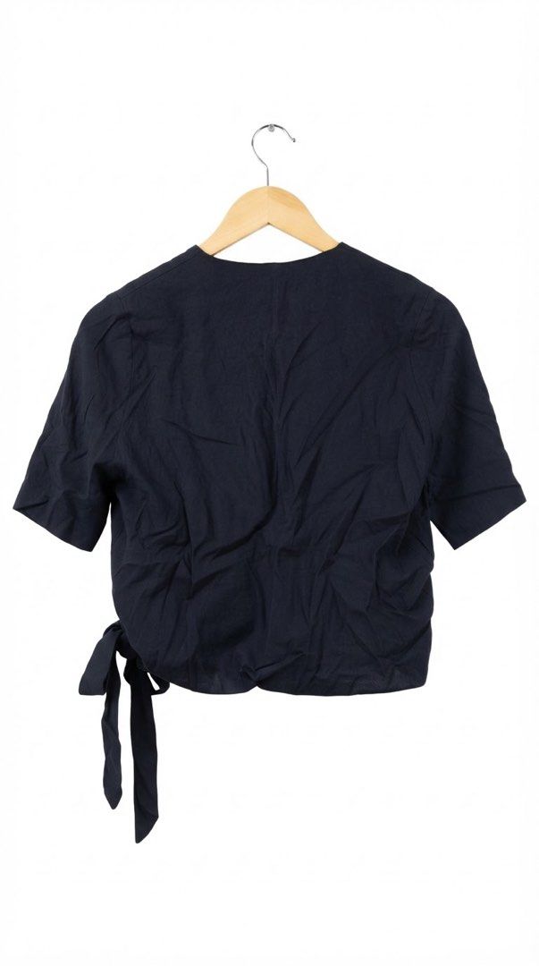 Zara Navy Blue Wrap Tie Short Sleeve Blouse (Category: Blouses) located in Cavite. Submitted by grandearth.39df3f (Listing ID 1468955332, Image 2). Description: - Brand: Zara - Color: Navy blue - Style: Wrap blouse with V-neckline and short sleeves - Closure: Secure side tie with fabric bow - Fabric: Lightweight and breathable - Versatility: Great for casual everyday wear or easy layering - Small on Tag but fit till Med. .