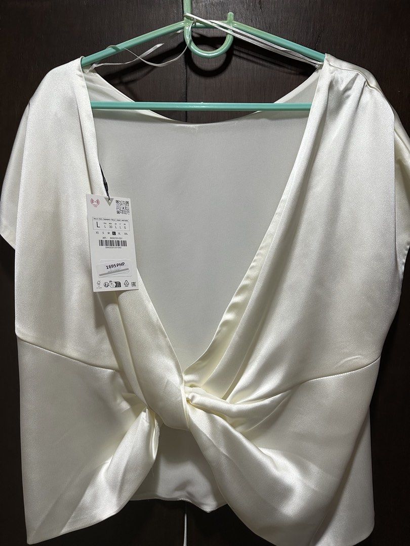 Zara Satin Twist Back Top (Category: Sleeveless) located in Muntinlupa City. Submitted by mikdecluttering (Listing ID 1469027032, Image 2). Description: - brand new with tags (original price: PHP 1,695) - never worn RFS: decluttering MOP: Metrobank, Gcash MOD: same day delivery (grab/lalamove) - sf shouldered by buyer - Muntinlupa .