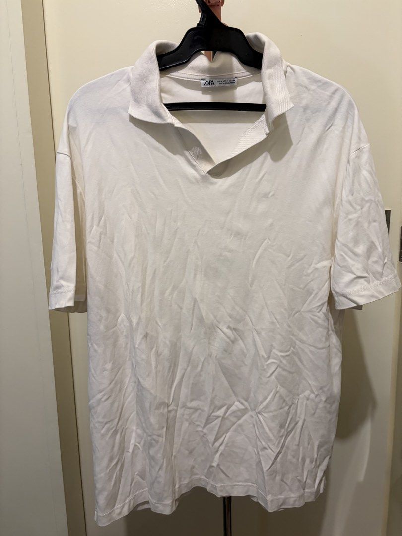 ZARA White Polo Shirt (Category: Tshirts & Polo Shirts ) located in Mandaluyong City. Submitted by icheeellee (Listing ID 1469086238, Image 1). Description: - Brand: ZARA - Size: M - Color: White - Material: Comfortable cotton - Fit: Relaxed fit - Features: Collar neck, short sleeves.