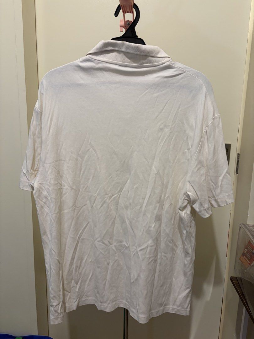 ZARA White Polo Shirt (Category: Tshirts & Polo Shirts ) located in Mandaluyong City. Submitted by icheeellee (Listing ID 1469086238, Image 2). Description: - Brand: ZARA - Size: M - Color: White - Material: Comfortable cotton - Fit: Relaxed fit - Features: Collar neck, short sleeves.