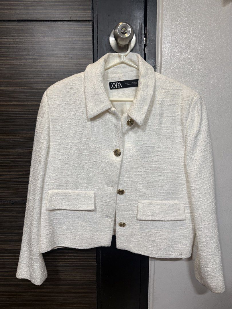 Zara White Textured Tweed Jacket (Category: Coats, Jackets and Outerwear) located in Manila. Submitted by marylemana (Listing ID 1469101014, Image 1). Description: Guaranteed authentic!! - Brand: Zara - Style: White tweed jacket with classic collar - Size: L (Made in Morocco) - Details: Textured fabric, gold-tone embossed metallic buttons, two front patch pockets - Lining: Fully lined interior - Condition: Never been used - Versatility: Perfect l
