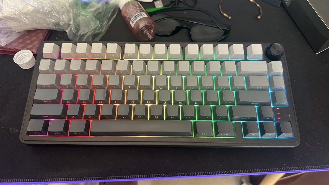 Zifriend RX75 Pro Mechanical Keyboard (Category: Computer Keyboard) located in Rizal. Submitted by kxithlynn (Listing ID 1468987117, Image 2). Description: - Model: Zifriend RX75 Pro Mechanical Keyboard - Connectivity: Tri-mode (USB, 2.4G wireless, and Bluetooth) - Design: Compact layout with two-tone grey and off-white keycaps - Lighting: Vibrant RGB backlighting and stylish side light strips - Features: Convenient top-right volume knob, dedicat