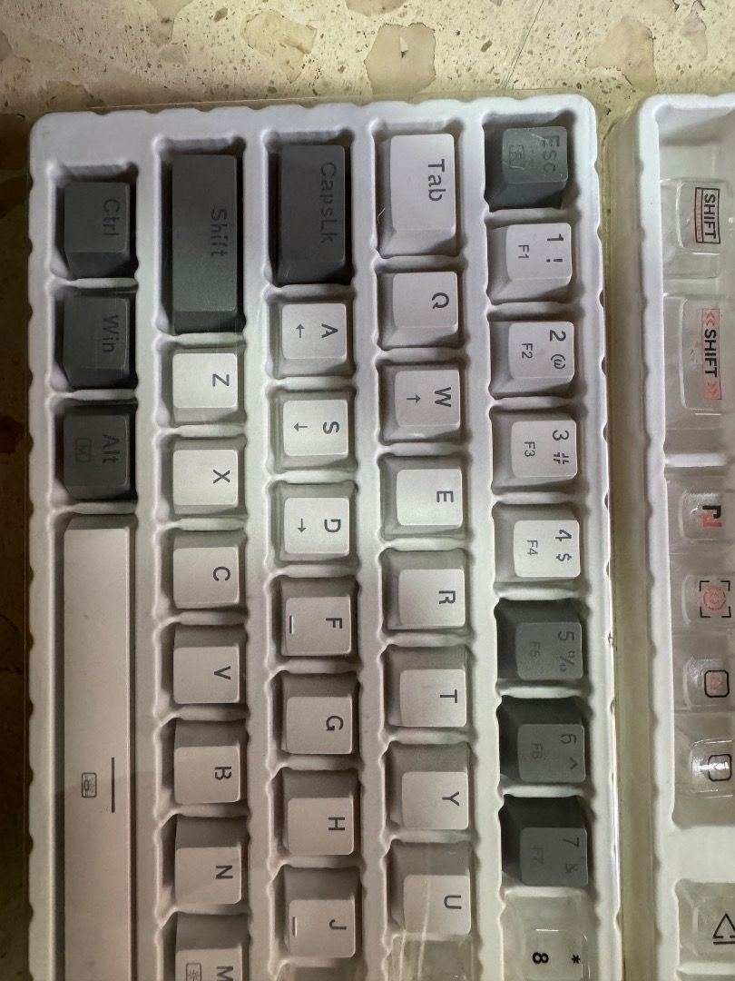 116 pcs Flashback Designed Keycap Set Front Printing (Category: Computer Keyboard) located in Paranaque City. Submitted by khloepetra (Listing ID 1465437369, Image 3). Description: - Condition: Brand new / Unused - White & Transparent/ Grey - Compatibility: Fits mechanical and optical keyboards - Design: Stylish grey and white colorway with front-printing layout - Inclusions: Full set of keys, plastic storage trays, original retail box, and a fre