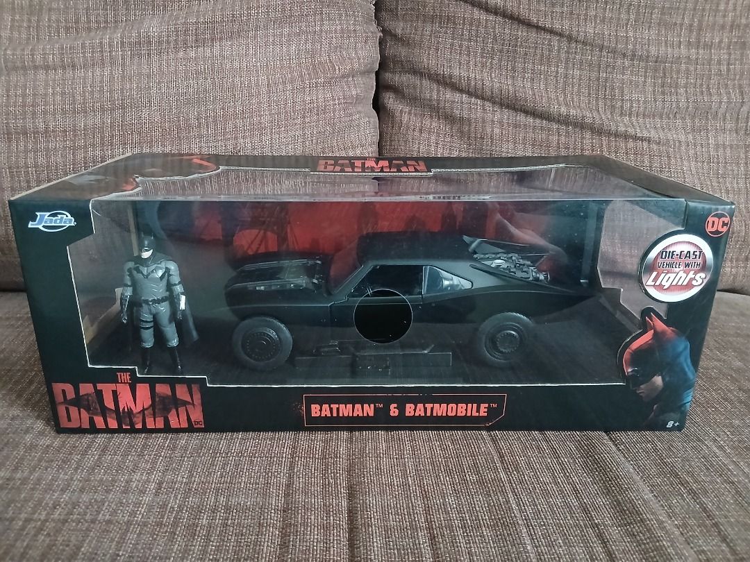 1:18 Jada Batmobile with Batman (Category: Vehicle & Diecast Models) located in Quezon City. Submitted by jerickjavier (Listing ID 1465470488, Image 1). Description: 1:18 Jada Batmobile with Batman - Batmobile Car, Reproduction of The 2022 Movie The Batman - Authentic/original made by Jada Toys - 1:18 Big scale, highly detailed - Made from Die-cast metal with rubber tires - Includes Batman figure (Also made from die-cast metal) - Features front, 