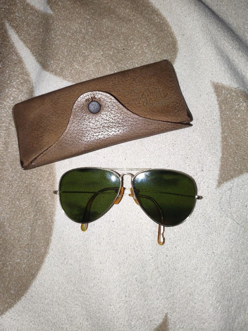 1950s Ray-Ban Bausch & Lomb 12k GF (READ DESCRIPTION) (Category: Sunglasses & Eyewear) located in Mandaluyong City. Submitted by elitemiko35 (Listing ID 1465517227, Image 1). Description: - ​Solid 1/10 12K gold-filled frame with visible dark spots and surface tarnish throughout body because of age - ​Green-tinted lenses with visible white hazing / cloudy spots on the front - ​Original vintage amber nose pads and ear tips intact - ​Temples curved 
