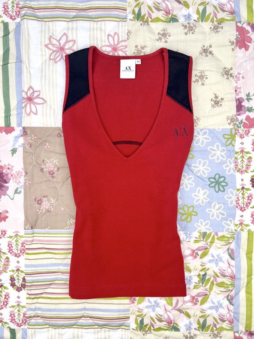 2000’s Armani Exchange Vneck Tank Top (Category: Sleeveless) located in Angeles City. Submitted by fruits.ph (Listing ID 1465437994, Image 1). Description: Measurements B:14” W:13” L:19” Size on Tag: XS Best Fit: S-M *Flat lay measurements* Mannequin Size: M (34”; 25”) Color Rate: 10/10 Flaws: None Fabric Type: Cotton Spandex/ Stretchable Fabric ***Color may vary due to lighting. This item is properly washed and disinfected.***.