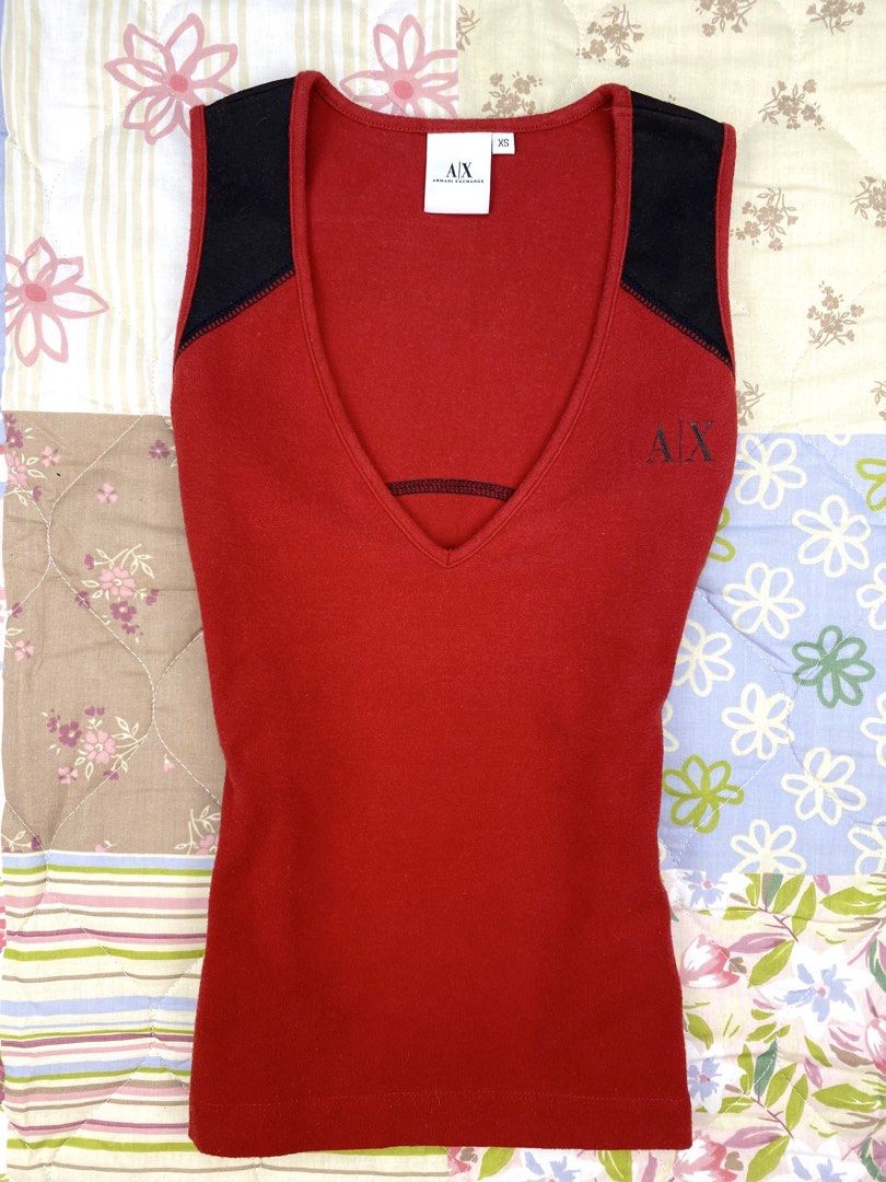 2000’s Armani Exchange Vneck Tank Top (Category: Sleeveless) located in Angeles City. Submitted by fruits.ph (Listing ID 1465437994, Image 2). Description: Measurements B:14” W:13” L:19” Size on Tag: XS Best Fit: S-M *Flat lay measurements* Mannequin Size: M (34”; 25”) Color Rate: 10/10 Flaws: None Fabric Type: Cotton Spandex/ Stretchable Fabric ***Color may vary due to lighting. This item is properly washed and disinfected.***.