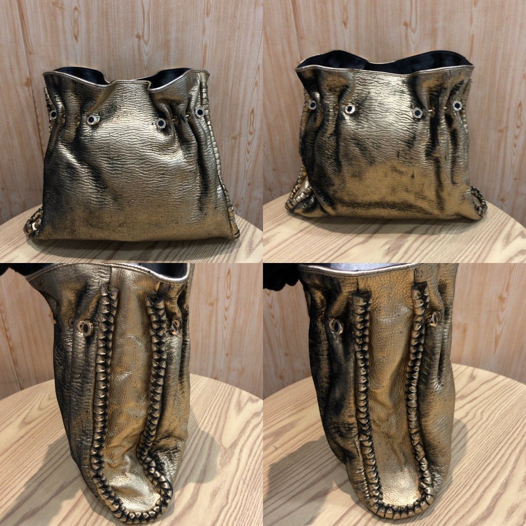 267009679 BVLGARI BAG METALLIC (Category: Luxury Bags & Wallets) located in Taguig. Submitted by ecoring.ph (Listing ID 1465403254, Image 2). Description: ◆CONDITION: BC ◆DESCRIPTIONS: (Other defects/info:) OUTER: The ribbed sheet fabric body of the bag is scratched, scuffed, stained, dirty, faded, wrinkled, and stiffened in parts, has a peeled coating and press marks, and shows signs of use. The knotted leather lining and gussets of the bag are 