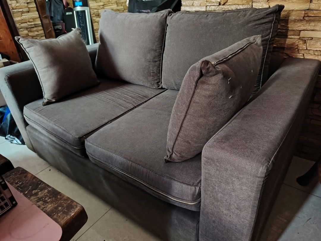 2-Seater Gray Sofa (Category: Sofas) located in Antipolo. Submitted by secondmusebags (Listing ID 1465421969, Image 1). Description: Bought for 20k+ 3 years ago Big 2-seater sofa with pillow and foam No lundo or uneven seat. Need cleaning only and has minor signs of usage on the side Courier/deliver must be shouldered by the buyer po Location; Mission Hills Antipolo City.