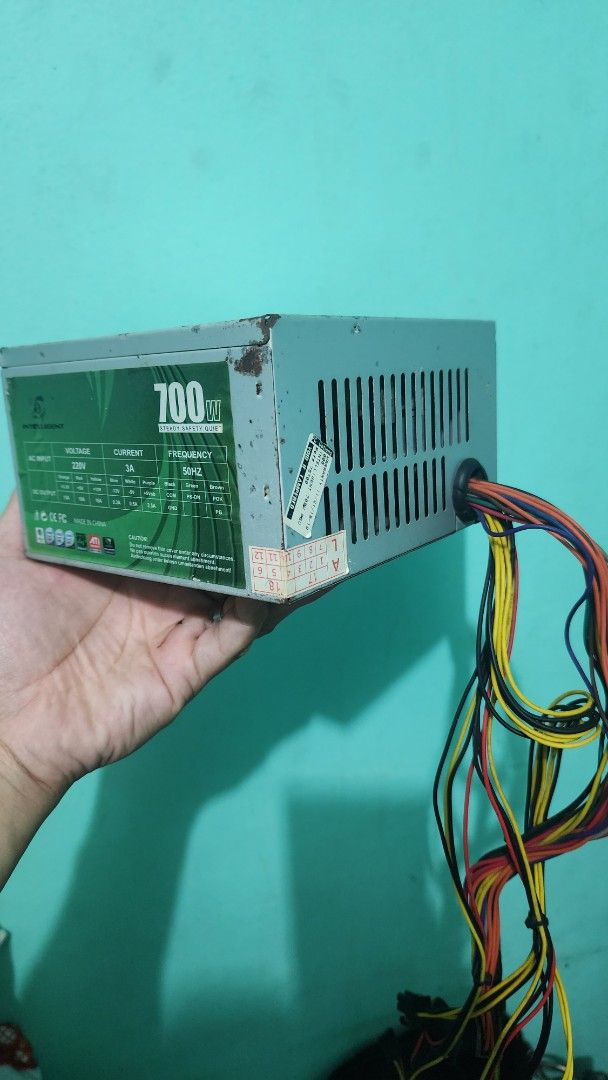 700W Computer Power Supply Unit PSU (Category: Computer Parts) located in Manila. Submitted by 3asy3 (Listing ID 1465501267, Image 1). Description: - Type: Desktop PC Power Supply Unit (PSU) - Power Output: 700 Watts - Form Factor: Standard ATX - Condition: Pre-owned, pulled from a fully working build - Design: Green and silver casing with top ventilatioN slots - Cabling: Attached multi-colored wires with standard connectors included - Ideal for 