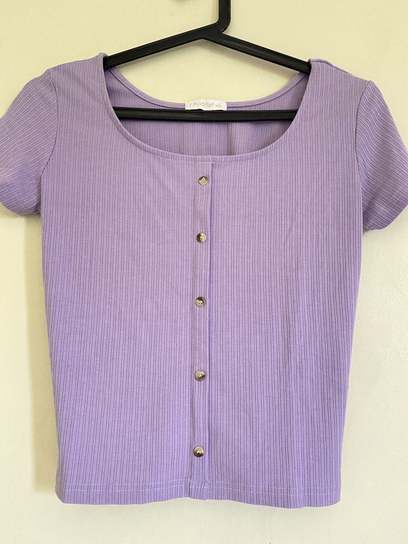 7.modifier Lavender Ribbed Button-Up Short Sleeve Top (Category: Shirts) located in Quezon City. Submitted by abssnf (Listing ID 1465394571, Image 1). Description: - Color: Lavender - Material: Soft, stretchy ribbed knit fabric - Design: Scoop neckline, short sleeves, and decorative silver front buttons - Brand: 7.Modifier - Condition: Great casual piece for everyday wear.